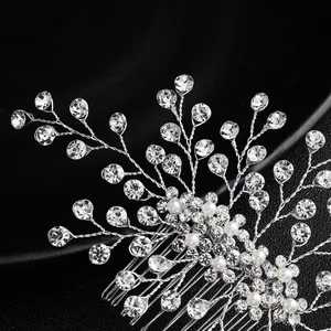 Silver bridal hair comb with pearls and rhinestones on elegant black background