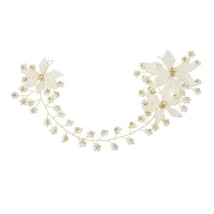 Elegant bridal hair vine with handmade white pearls and floral crystals on gold wire