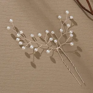 Handmade pearl bridal hair pin with silver wire branch design for elegant wedding styling