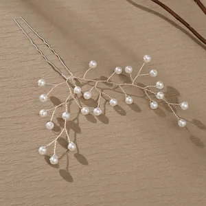 Handmade silver bridal hair pin with pearls and woven branch design for elegant hairstyles