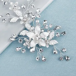 Exquisite silver floral hair clip with crystals and leaf accents for wedding hairstyles