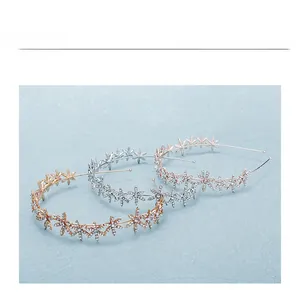 Detailed view of alloy star headbands with rhinestones in gold, silver and rose gold