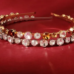 Double-layered gold headband with sparkling red, amber, and clear rhinestones