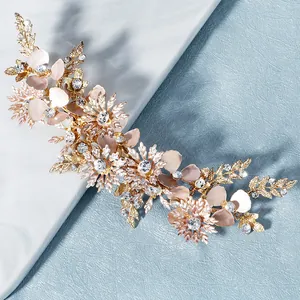 Handmade rose gold bridal hair comb with pink frosted flowers and sparkling rhinestones
