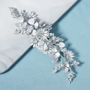 Elegant silver bridal hair vine with matte white flowers and sparkling zircons