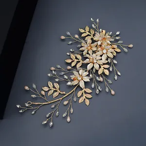 Detail of handmade golden floral headpiece with crystal beads and metal leaves