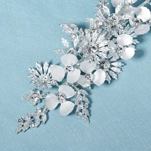 Elegant silver floral bridal hair clip with rhinestone leaves and frosted white petals