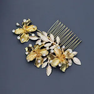 Detail of a golden floral hair comb with sparkling rhinestones for bridal hair styles
