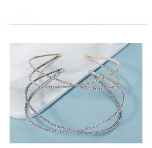 Detail of cross double-loop rhinestone headbands in gold and silver finish