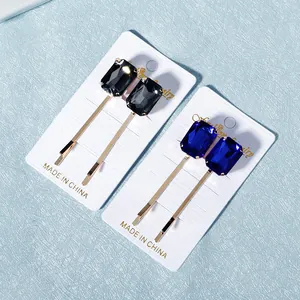 Elegante set de pinzas para el pelo con cristales rectangulares grises y azules y oro