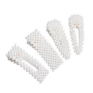 Set of four elegant faux pearl hair clips in geometric shapes for bridal and daily styling