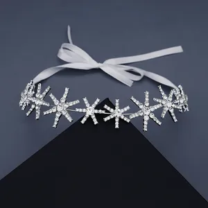 Sparkling snowflake rhinestone headband with white satin ribbon for elegant wedding hairstyle