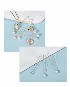 Close-up of handmade bridal hair pin with golden wires, pearls and metal leaf details