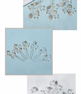 Detail of bridal hair pins set with elegant pearls and delicate golden leaf motifs
