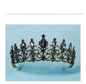 Detailed macro view of vintage bronze crown with black rhinestones and marquise stones