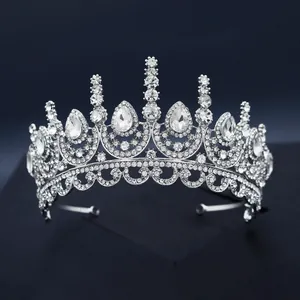 Luxury silver bridal crown with drop-shaped crystals and diamonds for wedding party