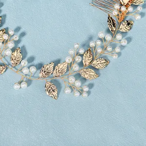Handmade gold leaf bridal hair comb with elegant white pearls for wedding hair styling