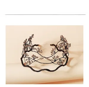 Detail of handcrafted ethnic style beaded headband with crystals in branch shape