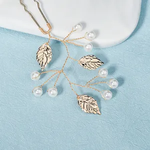 Elegant gold U-shaped hair pin with branch design, metallic leaves and white pearls