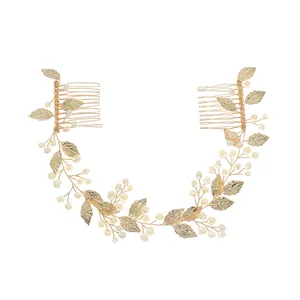 Handmade bridal hair comb with gold metal leaves and elegant white pearls for weddings