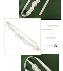 Detailed close-up of ivory lace bridal headband with silk ribbons on green satin fabric