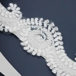 Elegant white lace bridal headband with floral embroidery, sequins and pearls for wedding