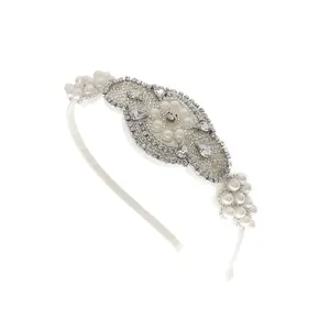 French vintage bridal headband with hand-stitched pearls and rhinestones on white base