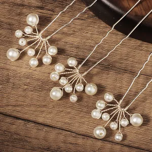 Three elegant U-shaped bridal hair pins with white pearls and silver metal wires