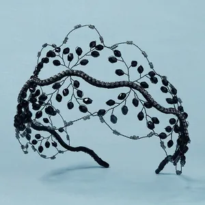 Detailed view of handmade black crystal beaded bridal headband with twig style wire design