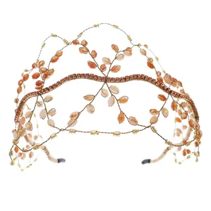 Detailed close-up of handmade gold metal wire weave with amber crystal beads on bridal crown