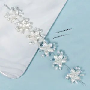 Handmade bridal pearl headband with acrylic flowers and silver wire for wedding photography