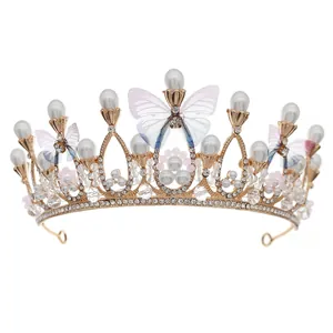 Elegant bridal crown with purple butterflies, white pearls, and rhinestones on gold frame