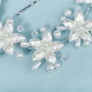 Handmade bridal headband with white acrylic flowers and elegant pearls for weddings
