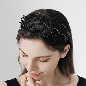Elegant wide bridal headband with black crystals and sparkling rhinestone wave pattern