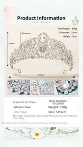 Detail of luxury bridal tiara with silver rhinestones and teardrop crystal, 6cm height