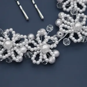 Handmade bridal headband with white pearls and sparkling crystal flowers on silver wire
