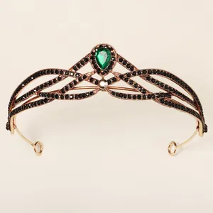 Baroque rose gold crown with black rhinestones and a teardrop emerald green crystal