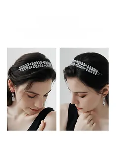 Detail of handmade bridal headband with silver wire, crystals, and white rhinestones