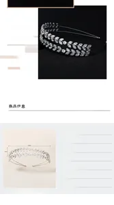 Close-up of silver tiara with marquise-cut zircons in elegant leaf and vine patterns