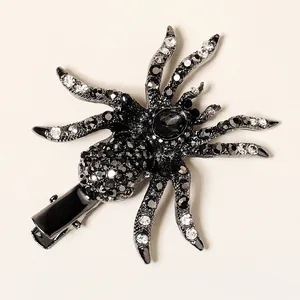 Detail view of the spider hair clip showing intricate rhinestones and duckbill clip