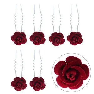 Detail view of 6-piece deep red velvet rose U-shaped hair pins with stable metal waves