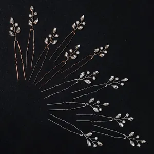 Handmade bridal U-shaped hair pins set with crystals and pearls on a black background