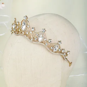 Macro shot of luxury gold bridal tiara with sparkling rhinestones and marquise cut zircons