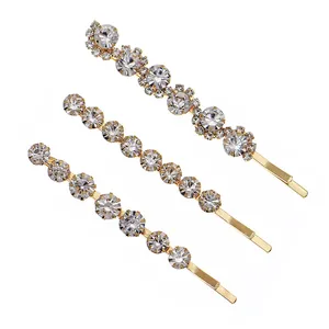 Three-piece gold-tone minimalist hair clip set with sparkling white rhinestones