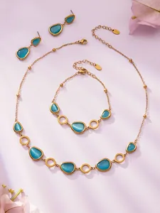 Detail von Luxus Gold Edelstahl Schmuckset mit blauen Tropfen-Opalsteinen im Set