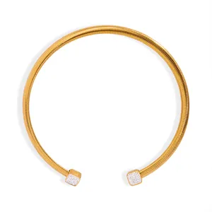Golden tubogas choker necklace with crystal pave square tips and spiral metal texture