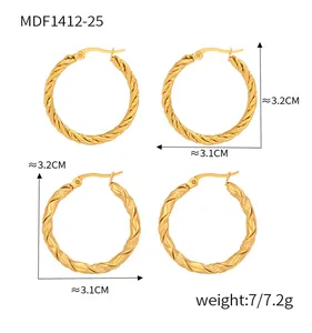 Detailed view of gold twisted hoop earrings with dimensions 3.2cm height and 3.1cm width