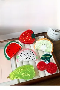 Collection of vibrant fruit-shaped acrylic hair claws including strawberry and watermelon