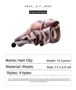 Detail showing pink satin fabric banana hair clip with specific dimensions and weight