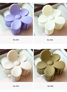 Detailed grid view of matte flower hair claws in purple, cream, apricot and olive green